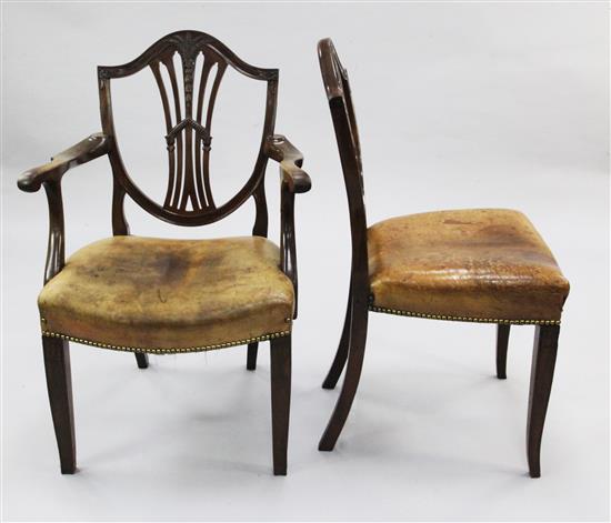 A set of twelve Hepplewhite style mahogany dining chairs